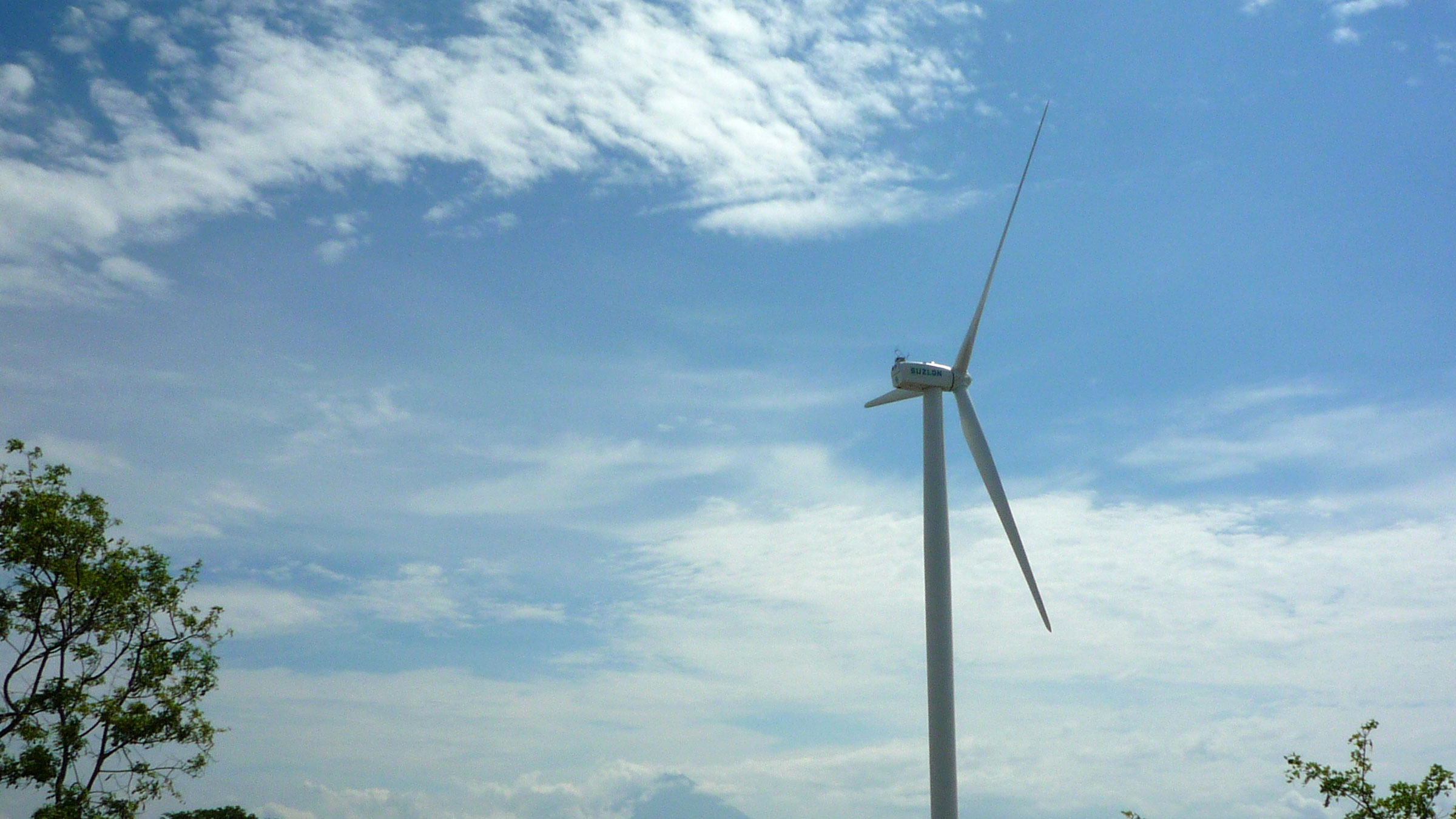 Wind turbines and Isla de Ometepe, Nicaragua. Used under CC BY-NC 2.0 from Nyall & Maryanne on Flickr.